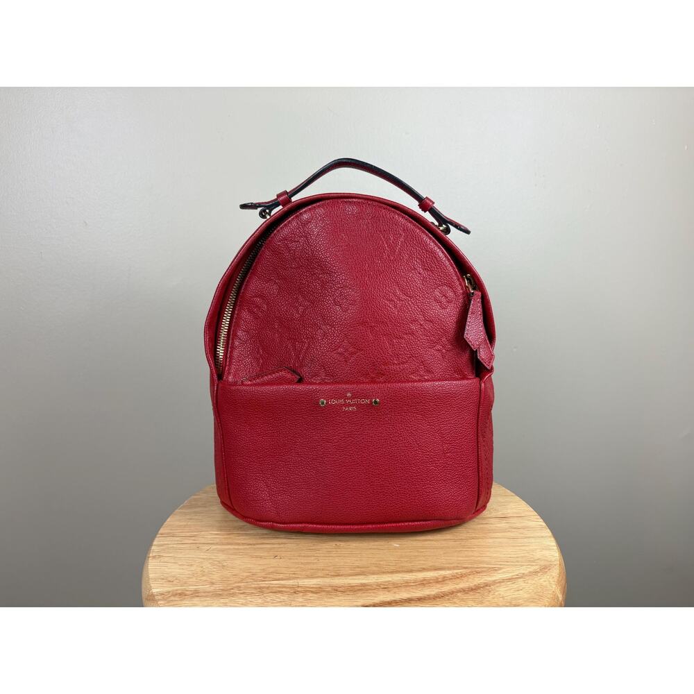 Authentic Louis Vuitton Monogram Empreinte Sorbonne Backpack in Cerise